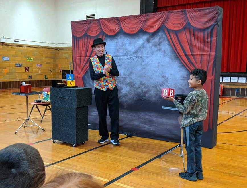 Marty the Magician performs ABC Block trick for boy